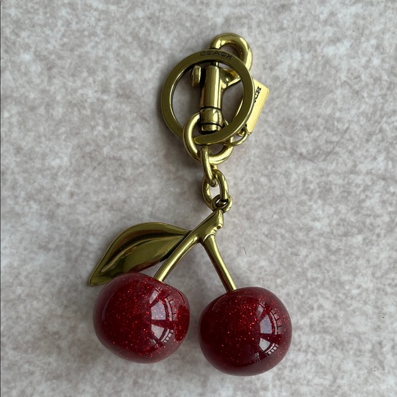 Coach Accessories - Coach Gold-Tone Cherry Key Charm with Red Glitter